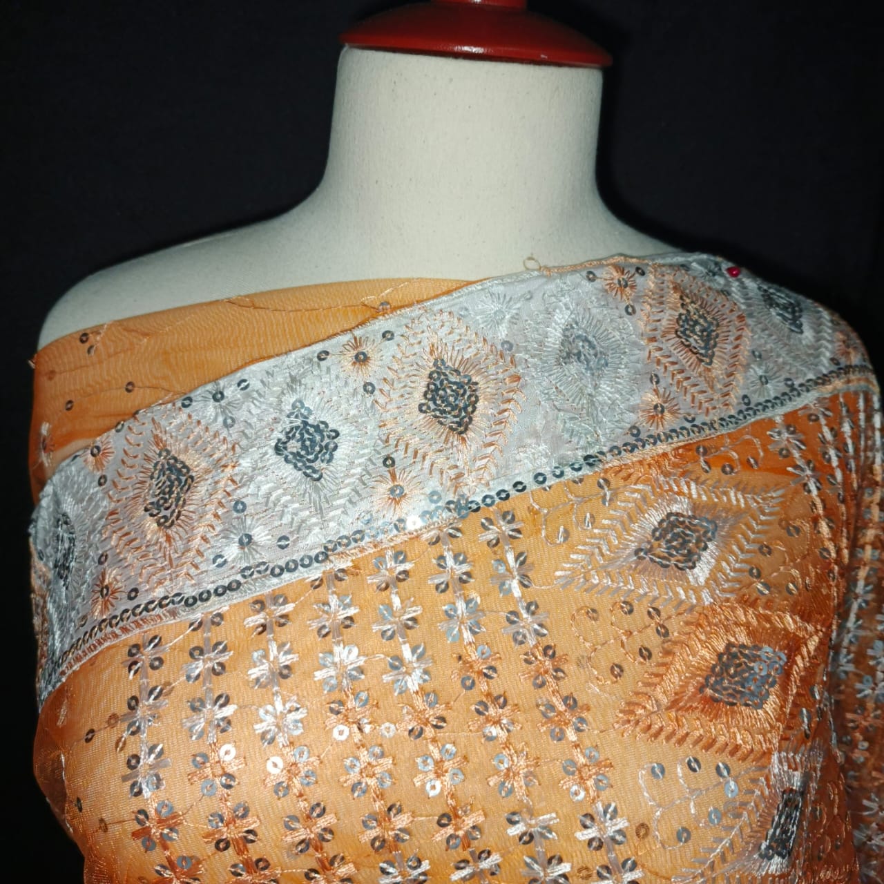 Elegant Orange Net Saree with Silver Sequin & Thread Embroidery