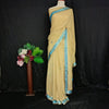 Beige Saree with Aqua Blue Embellished Border