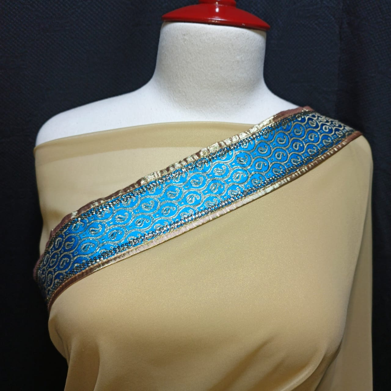 Beige Saree with Aqua Blue Embellished Border
