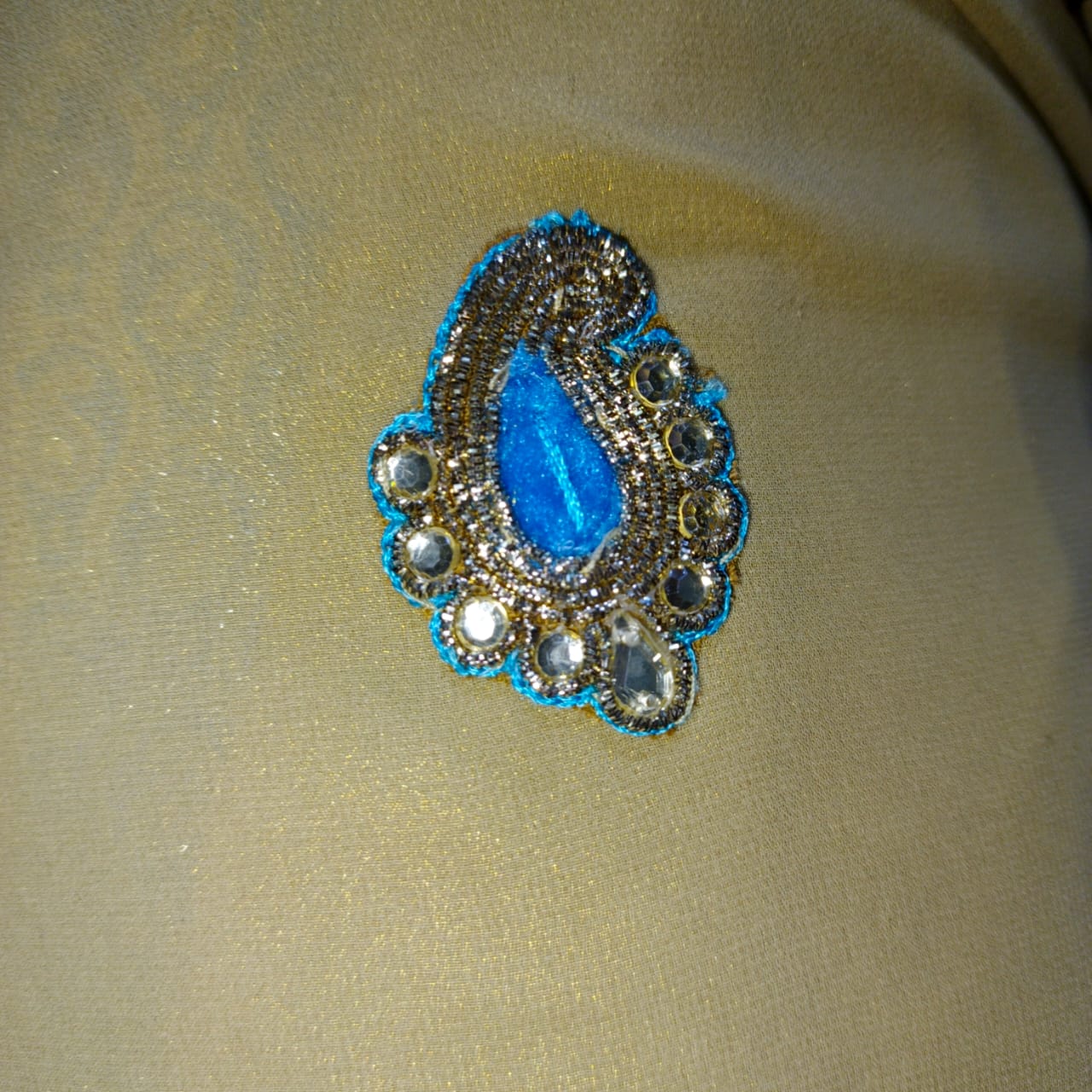 Beige Saree with Aqua Blue Embellished Border